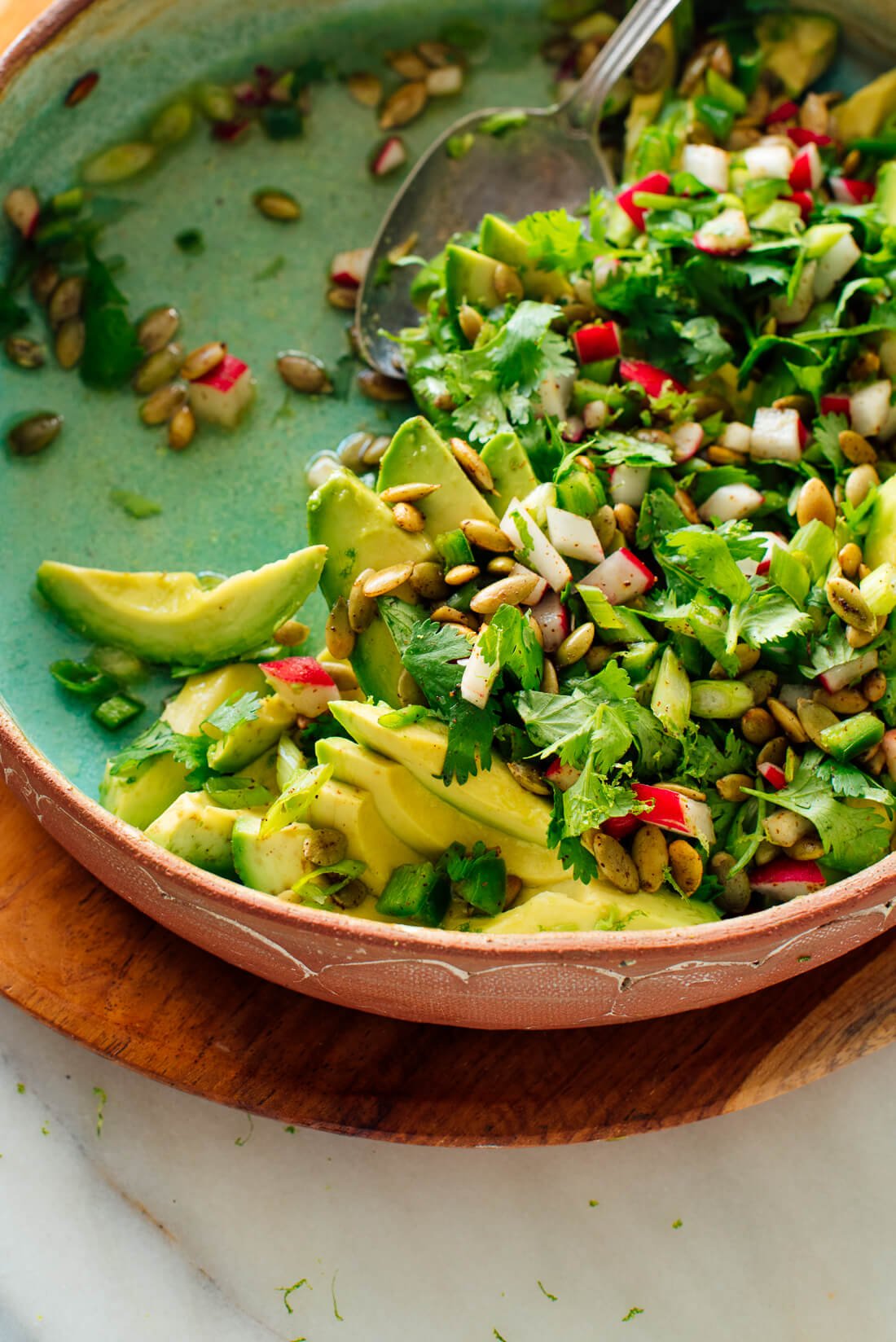 avocado salad with herbs, radishes and pepitas