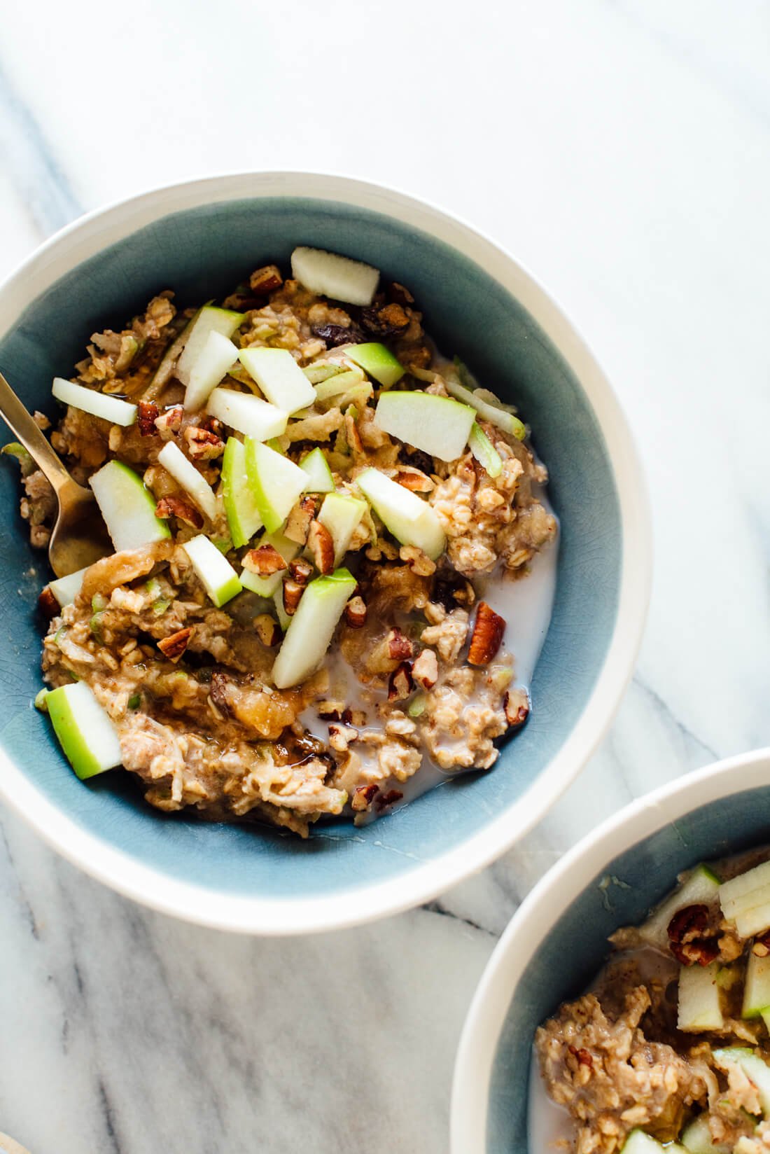 The best bircher muesli recipe, made with old-fashioned oats, homemade applesauce, fresh Granny Smith apple, and nuts.