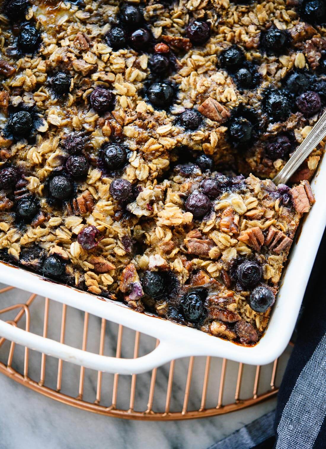 Amazing blueberry baked oatmeal, so good with yogurt in the mornings! - cookieandkate.com