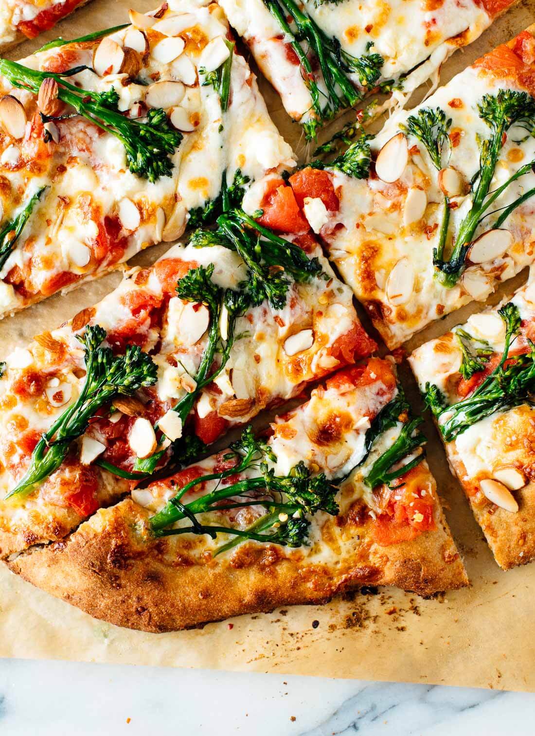 Homemade broccolini pizza with almonds (optional), mozzarella and red sauce! The trick to making awesome broccolini pizza is to blanch the broccolini first.