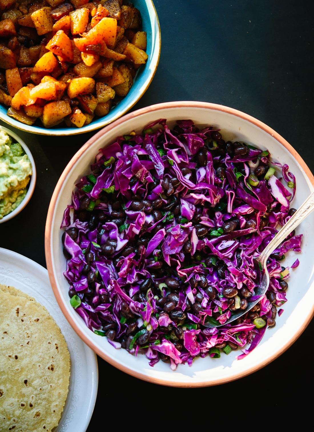 Super easy lime-marinated cabbage and black bean slaw - cookieandkate.com