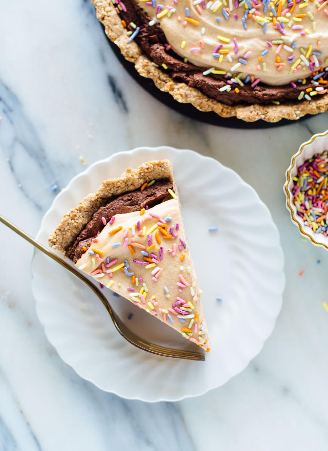 This chocolate peanut butter tart is creamy and delicious! It's also vegan, gluten free, and naturally sweetened, believe it or not!