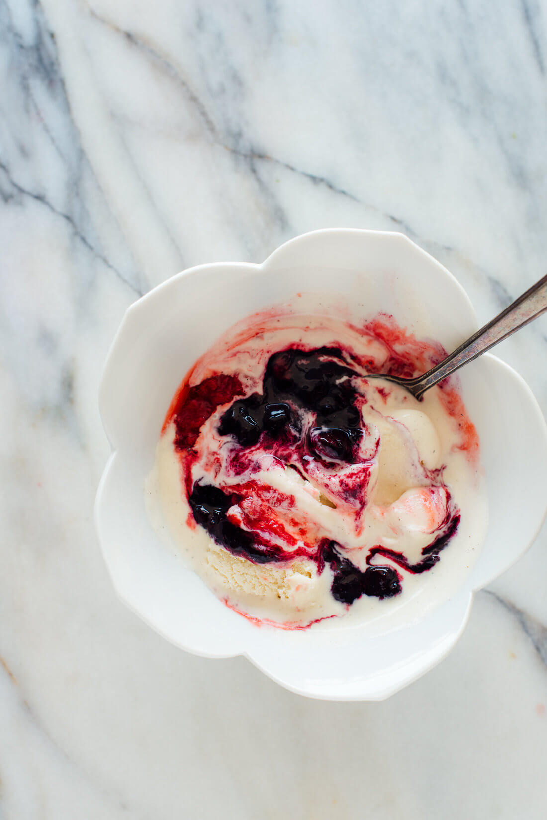 Blueberry compote swirled into melted ice cream