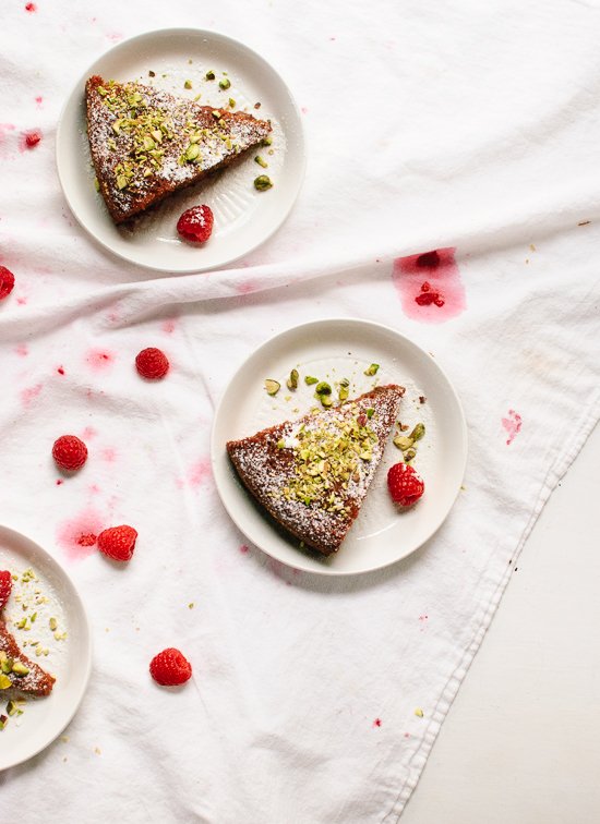 Flourless orange and raspberry cake made with almond meal and sweetened with honey! cookieandkate.com