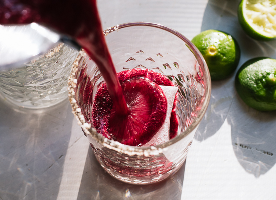 frozen blueberry margaritas pour