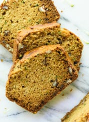 Fluffy and moist zucchini bread, made healthier with whole grains, natural sweetener (honey or maple syrup), and coconut oil instead of butter. cookieandkate.com