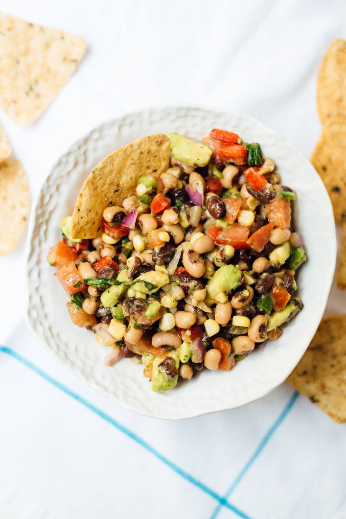 This homemade cowboy caviar is a popular Southern bean salad/salsa. It's always a hit at summer potlucks and it's healthy, too. cookieandkate.com