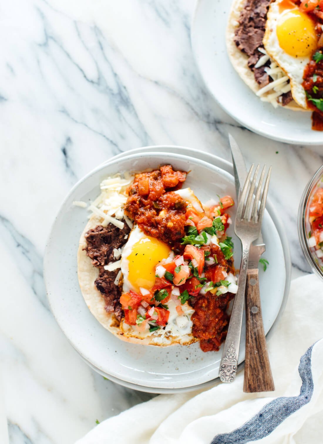 Classic huevos rancheros recipe made fresher with pico de gallo on top!