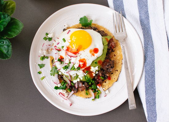 Huevos rancheros with avocado salsa verde and black beans