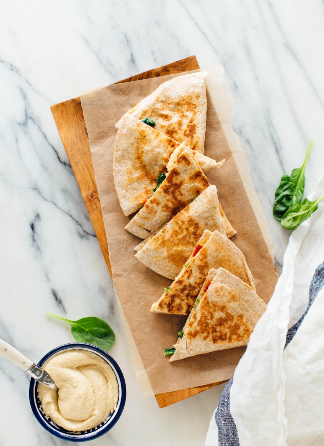 These quesadillas are made with hummus instead of cheese, and they are absolutely delicious! These hummus quesadillas are a healthy, dairy-free and vegan snack or meal. cookieandkate.com