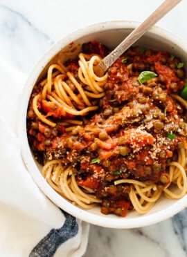 lentils with marinara sauce and pasta with twirled fork