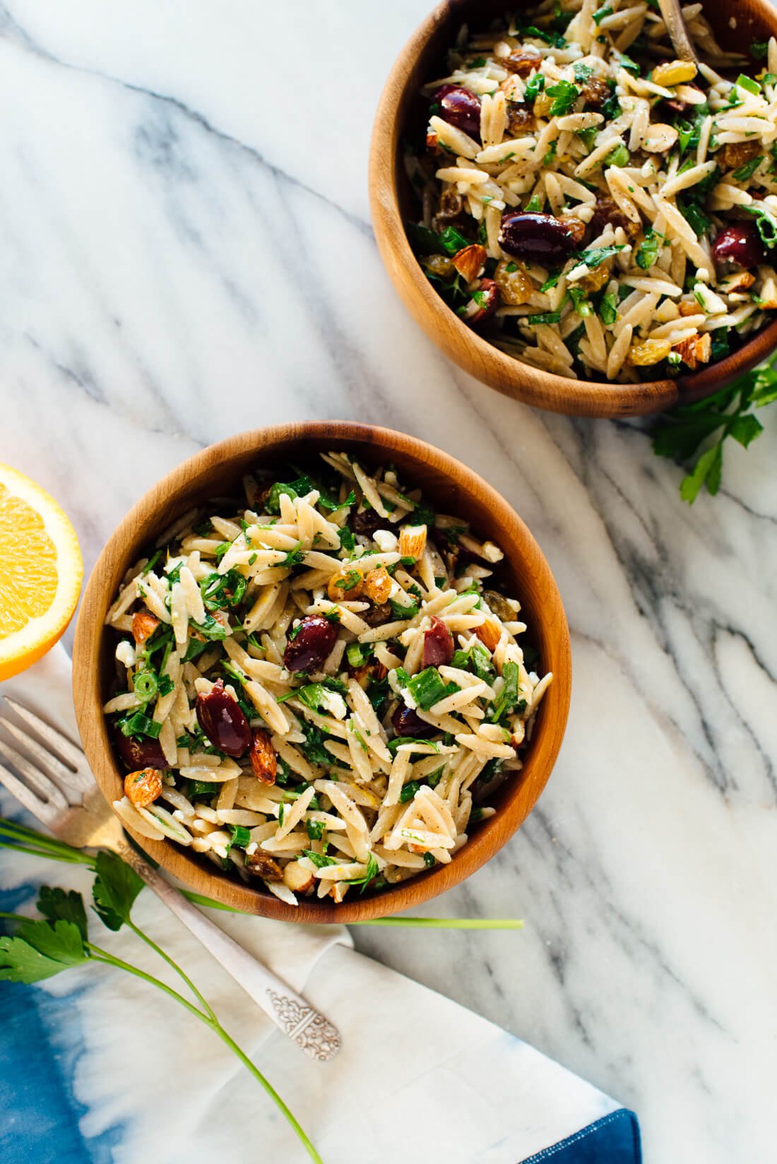 mediterranean orzo salad with orange parsley almonds in bowls