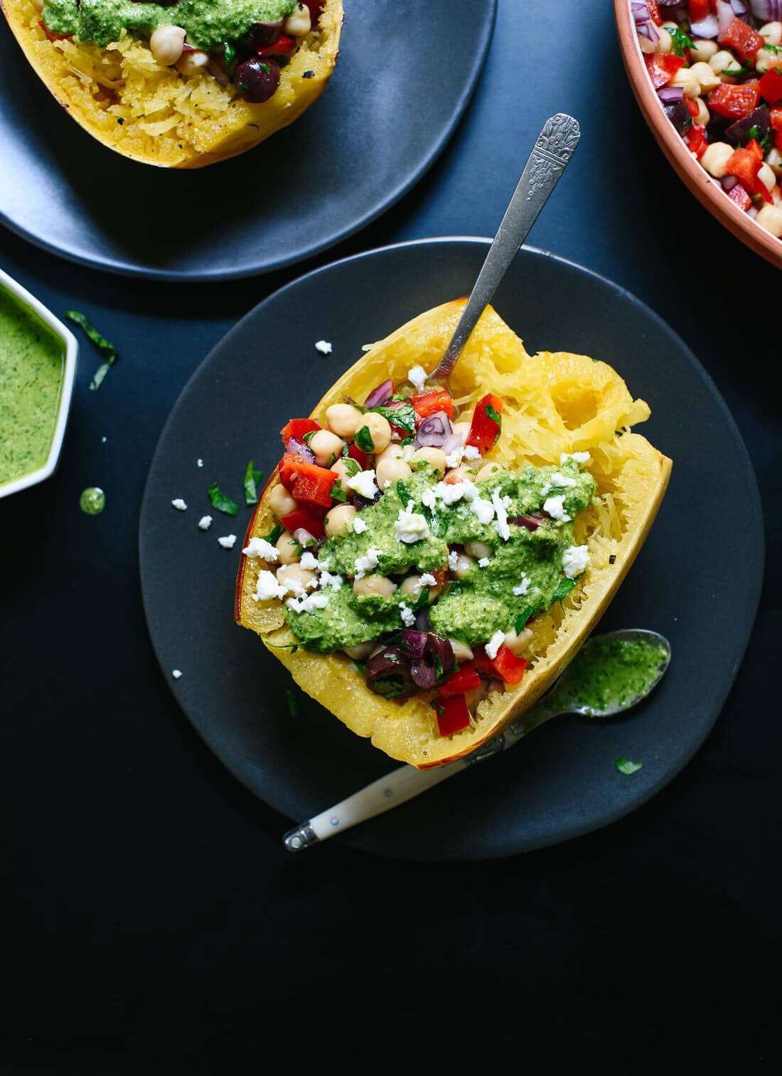 Fresh and healthy roasted spaghetti squash loaded with chickpeas, bell pepper and pesto! cookieandkate.com