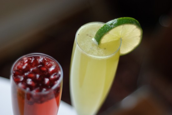 kiwi lime champagne cocktail with pomegranate prosecco