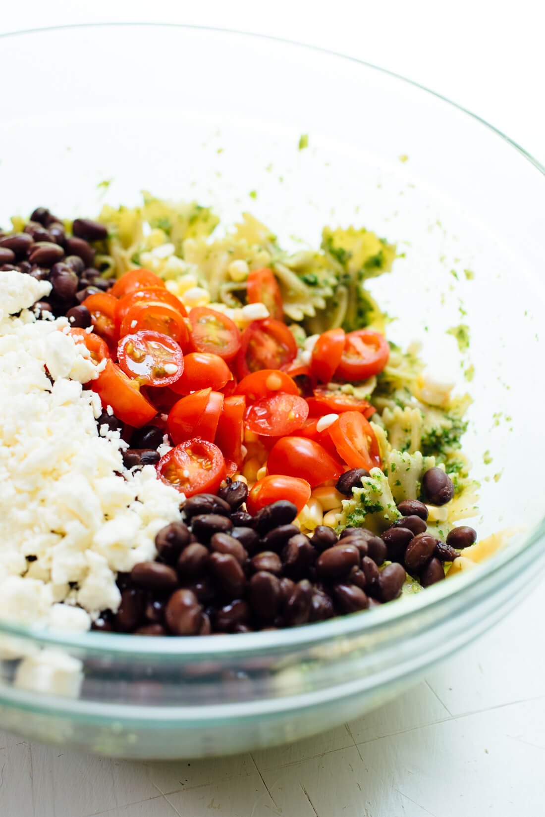 How to make pasta salad with corn, tomatoes, black beans and feta!