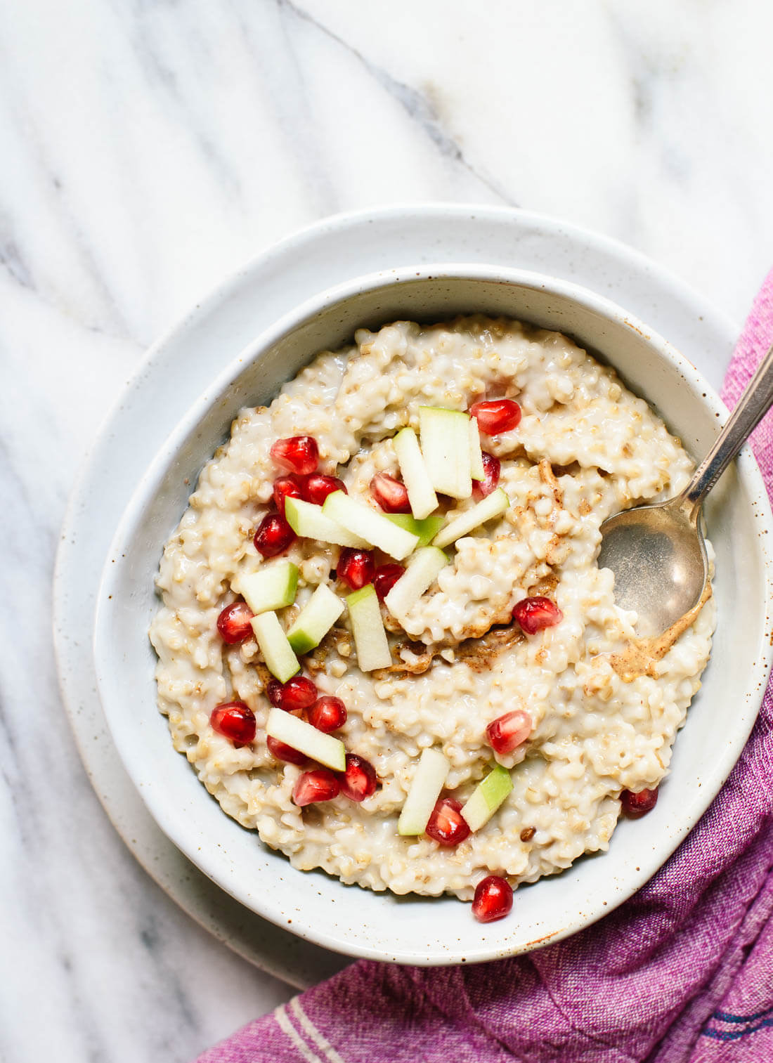 Ultra creamy, toasted steel-cut oats. Learn how to cook a batch that lasts all week! cookieandkate.com