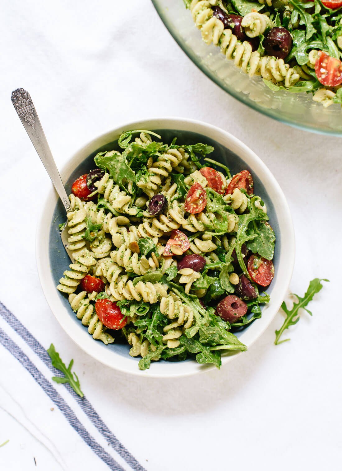 This pesto pasta salad recipe is bursting with fresh flavor! It's light, healthy and easy to make. Perfect for picnics and potlucks! cookieandkate.com