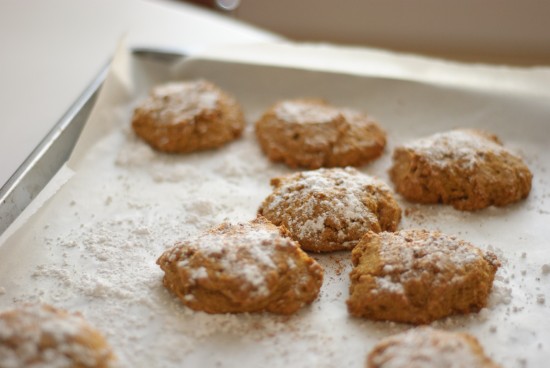 baked pumpkin cookies topped with powdered sugar