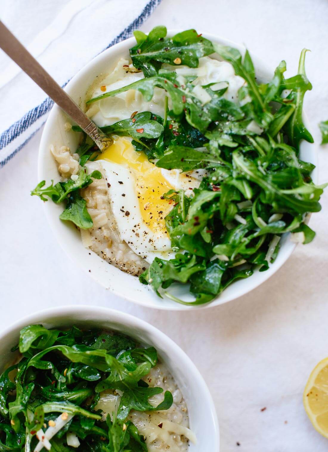 Savory steel cut oatmeal with arugula and a fried egg on top - cookieandkate.com