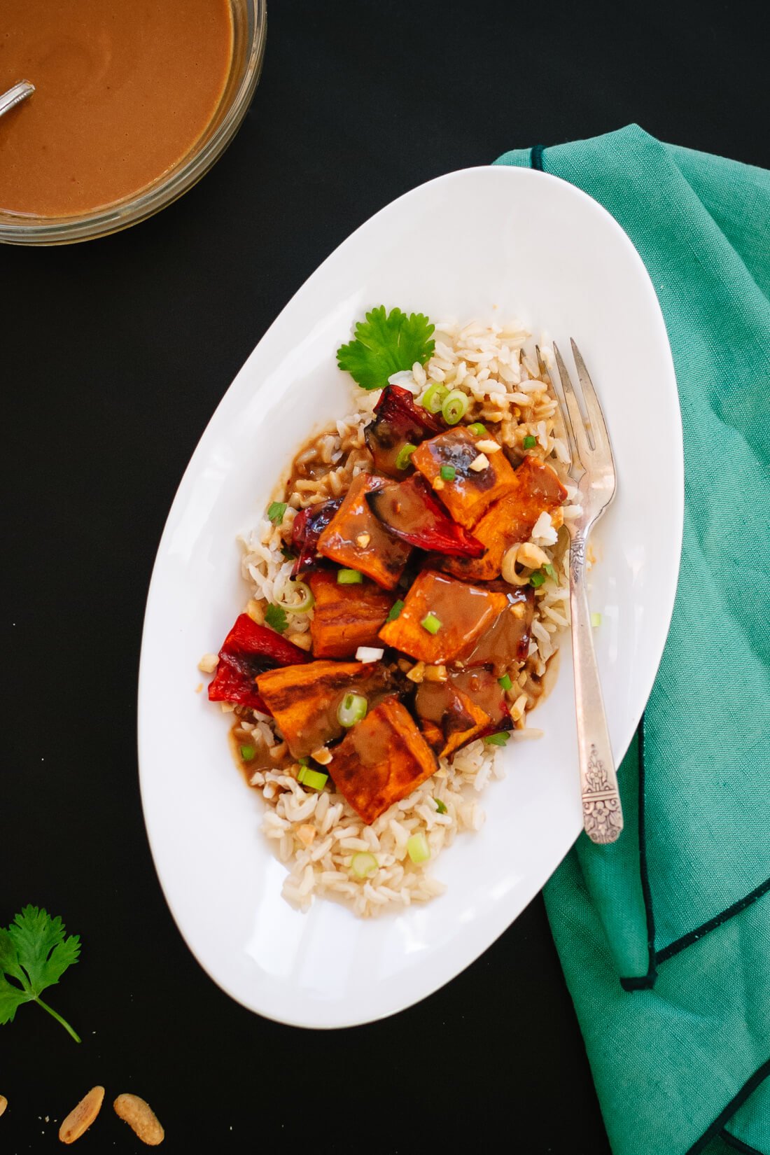 Spicy Thai Peanut Sauce over Roasted Sweet Potatoes and Rice