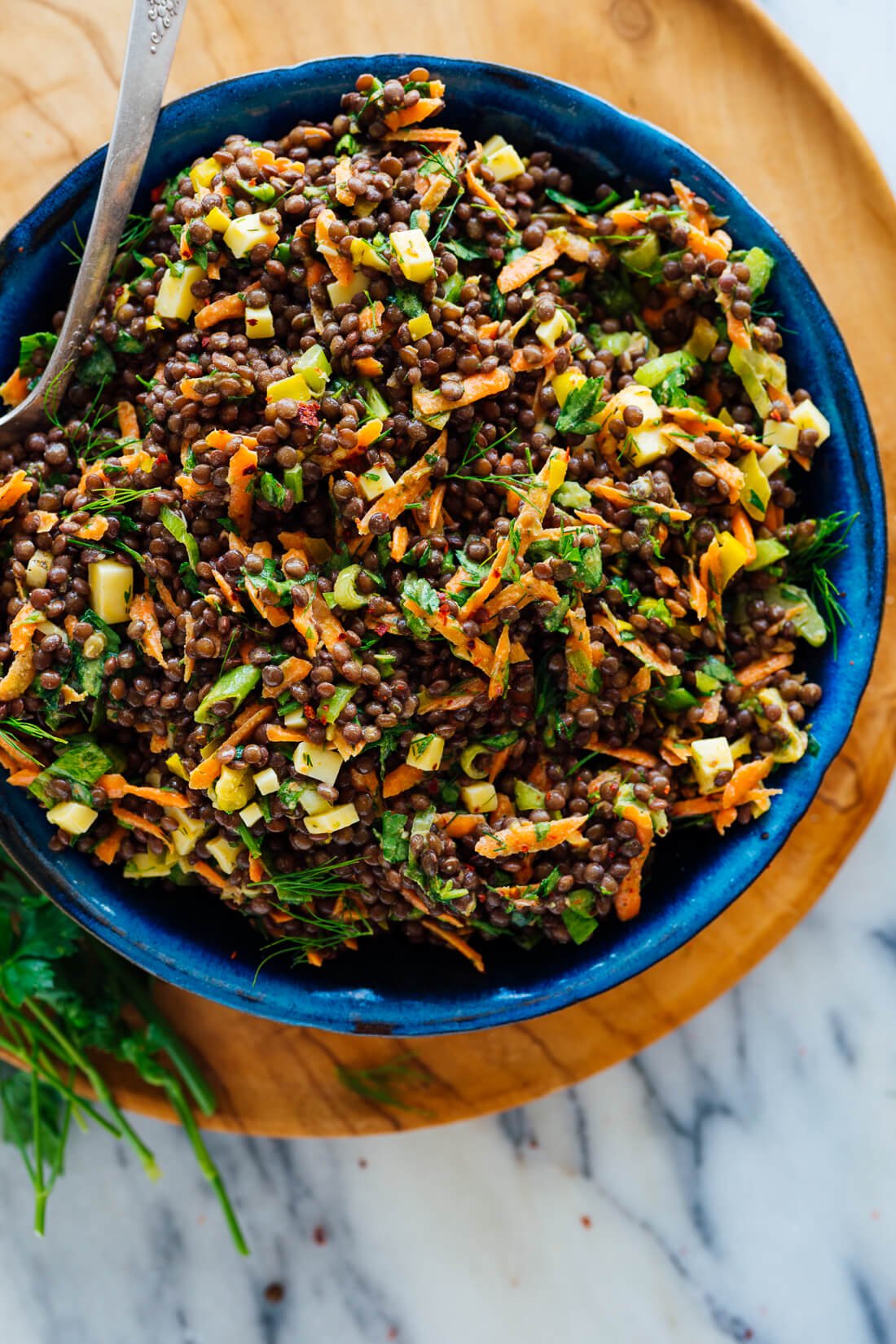 tangy lentil salad in blue bowl