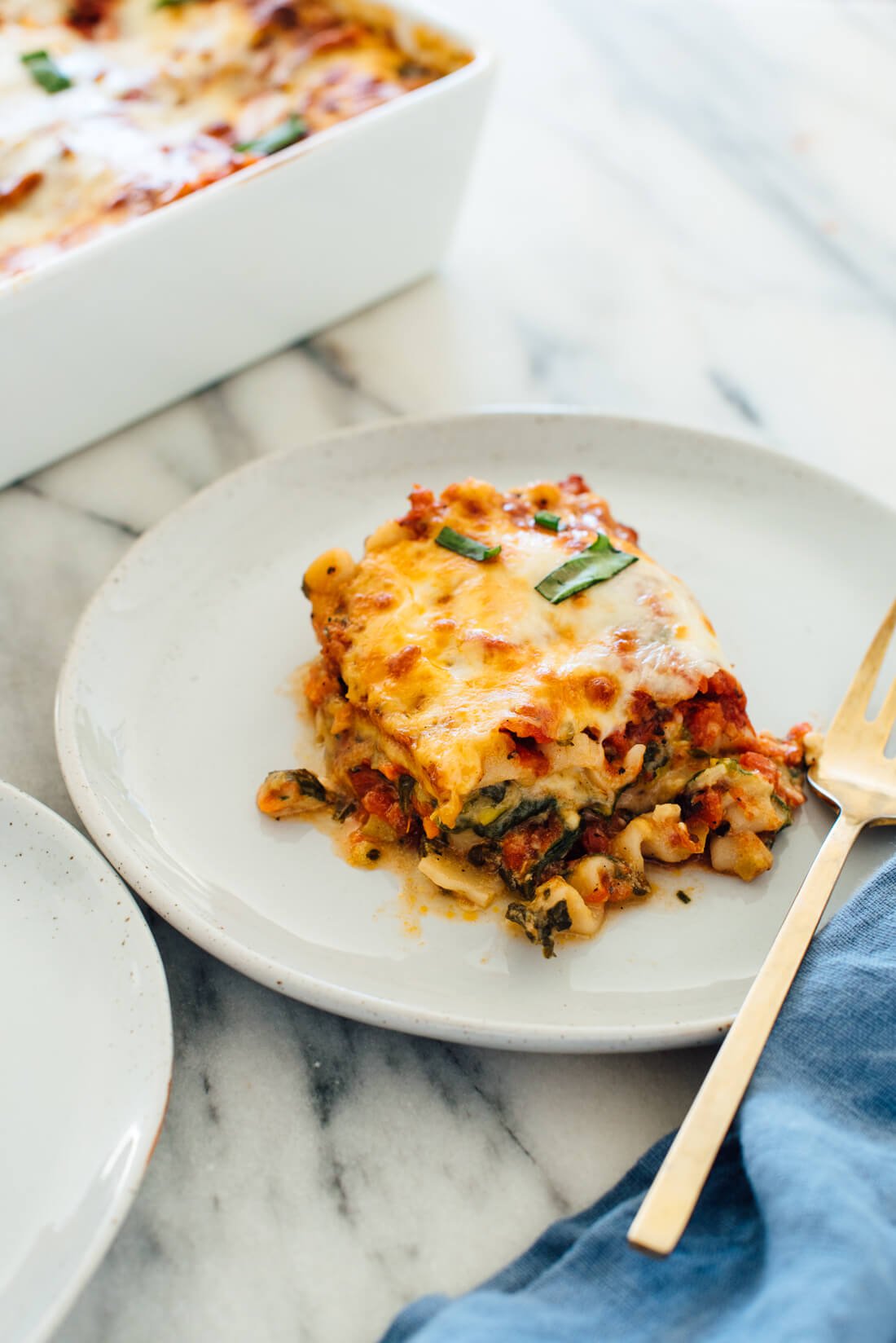 My favorite vegetable lasagna recipe, made with zucchini, bell pepper, carrots and spinach! No one will miss the meat in this #vegetarian #lasagna.