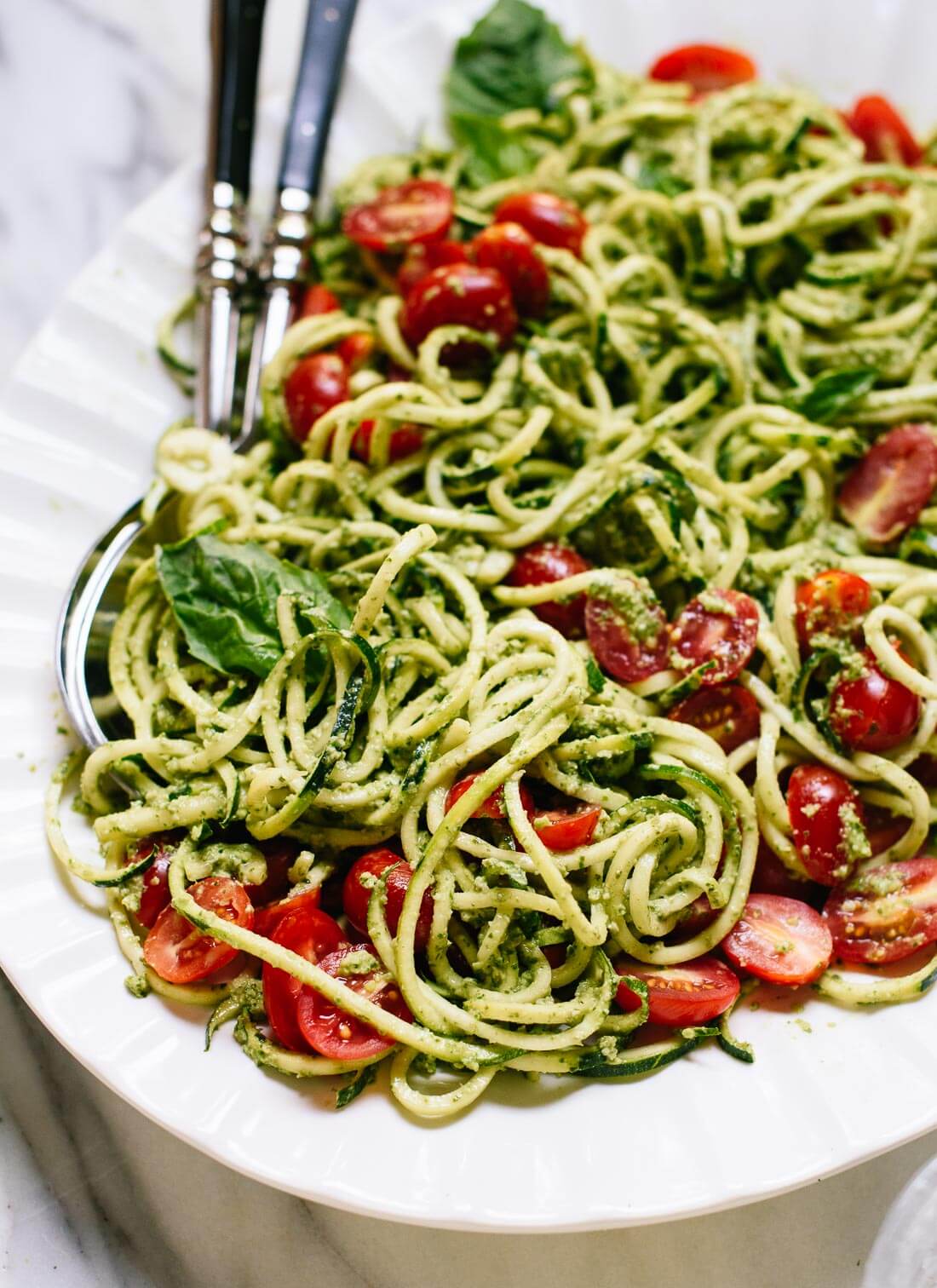 Healthy zucchini noodles with pesto and cherry tomatoes! cookieandkate.com